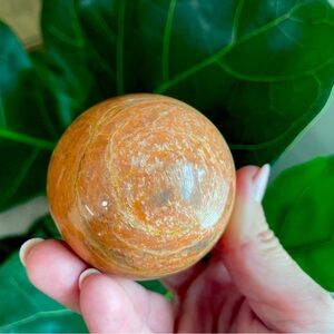 Peach moonstone sphere with chatoyance
